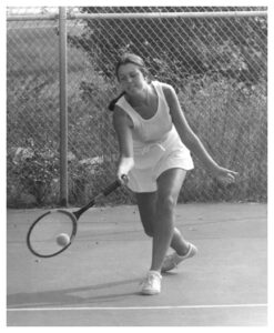 Debbie playing tennis in high school